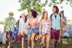 Young friends arriving at their campsite