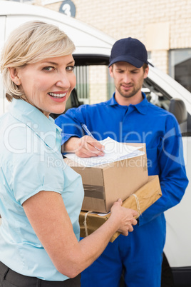 Happy delivery man with customer