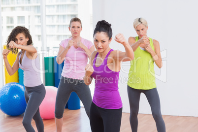 Women boxing at fitness studio