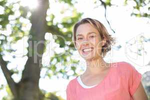 Happy young woman in the park