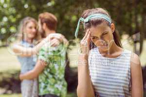 Brunette upset at seeing boyfriend with other girl