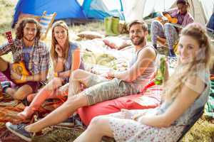 Hipsters having fun in their campsite