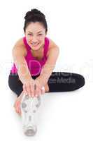 Fit woman stretching her leg