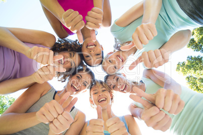 Fitness group standing in circle