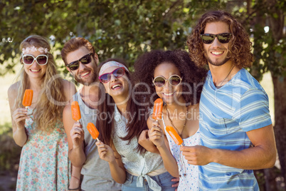 Hipster friends enjoying ice lollies
