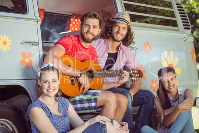 Hipster friends by their camper van