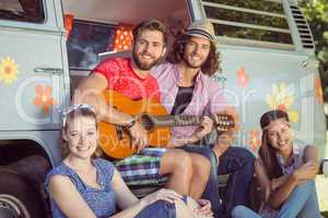 Hipster friends by their camper van