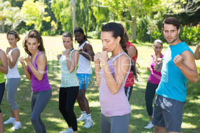 Fitness group working out in park