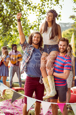 Pretty hipster on friends shoulders