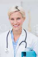 Confident female doctor smiling in clinc