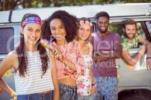 Hipsters hanging out by camper van