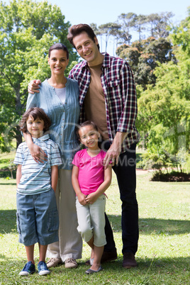 Happy family smiling at camera