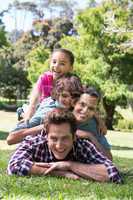 Happy family smiling at camera