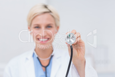 Smiling female doctor holding stethoscope