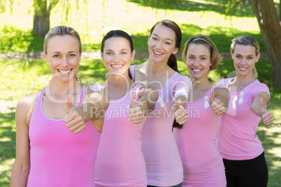 Smiling women in pink for breast cancer awareness Smiling women in pink for breast cancer awareness