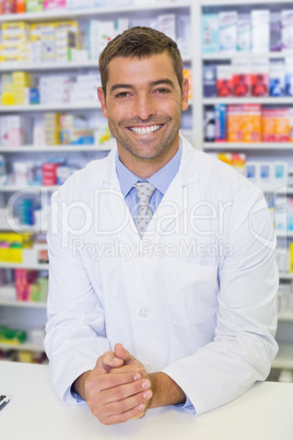 Handsome pharmacist smiling at camera