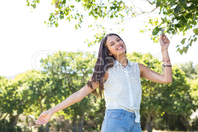 Pretty brunette smiling in park