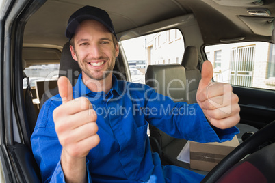 Delivery driver smiling at camera in his van