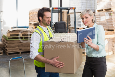 Warehouse worker and manager using tablet pc