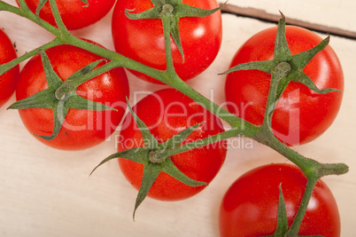 fresh cherry tomatoes on a cluster