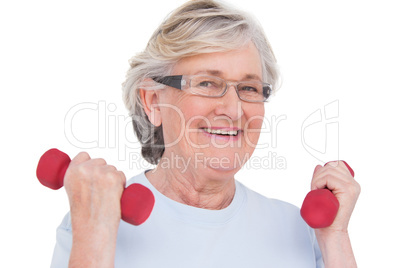 Senior woman lifting hand weights