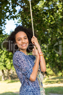 Pretty young woman in swing