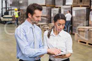 Focused warehouse managers working together