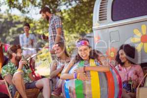 Happy hipsters having fun on campsite