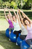 Fitness group sitting on exercise balls