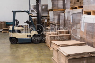 Forklift in a large warehouse