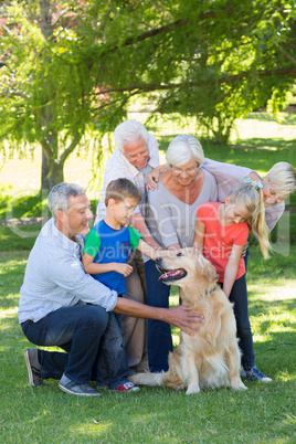 Happy family petting their dog