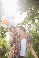Cute couple having fun with balloons