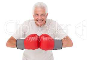 Senior man in boxing gloves