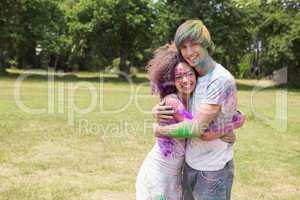 Young friends having fun with powder paint