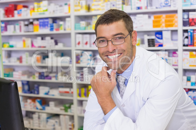 Smiling pharmacist looking at camera