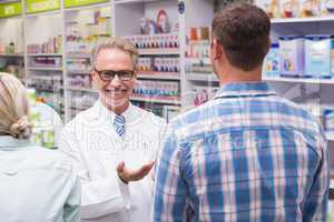 Smiling pharmacist looking at camera