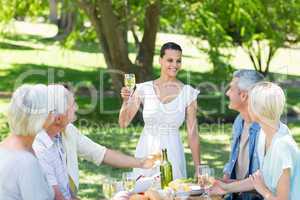 Pretty brunette toasting with her family