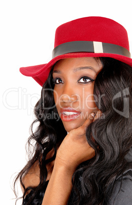 Closeup of black girl with red hat.