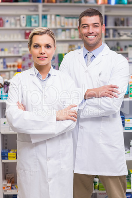 Team of pharmacists smiling at camera