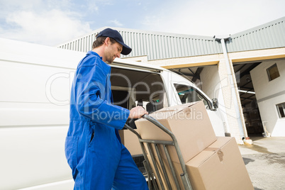 Delivery driver packing his van