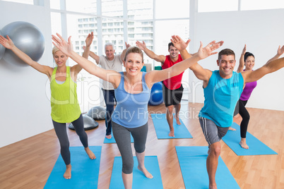 People exercising in gym class