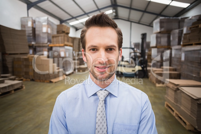 Smiling male manager in warehouse