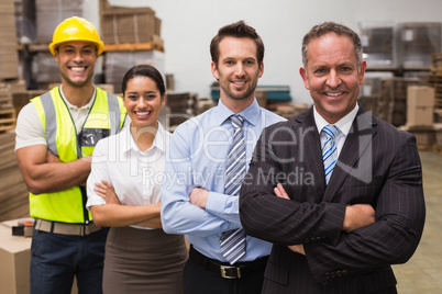 Warehouse team smiling at camera