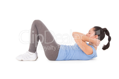 Fit brunette doing sit ups