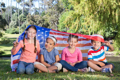 Happy little friends with american flag