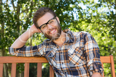 Handsome hipster relaxing in the park