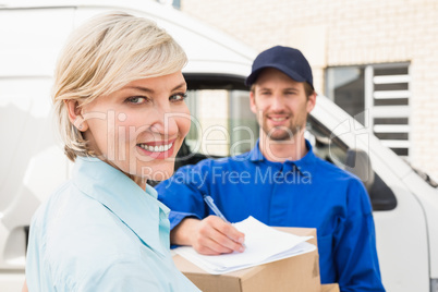 Happy delivery man with customer