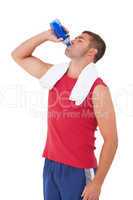 Fit man drinking water from bottle