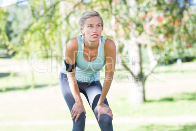 Pretty blonde jogging at the park