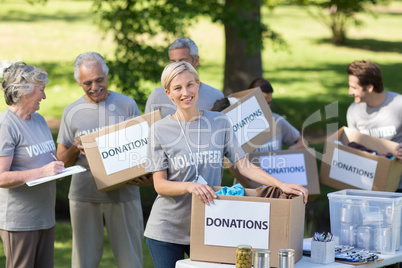 Happy family holding donations boxes